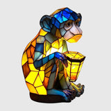 Žltý sklenený opičák s LED svetlom